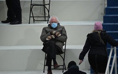 Former presidential candidate, Senator Bernie Sanders (D-Vermont) sits in the bleachers on Capitol Hill before Joe Biden is sworn in as the 46th US President on January 20, 2021, at the US Capitol in Washington, DC. (Photo by Brendan SMIALOWSKI / AFP)