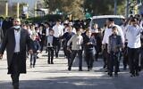 Illustrative - Haredi schoolchildren outside a school in the city of Ashdod, January 22, 2021. (Jack Guez/AFP)