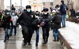 Police detain a man during a rally in support of jailed opposition leader Alexei Navalny in downtown Moscow on January 23, 2021 (NATALIA KOLESNIKOVA / AFP)
