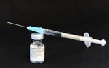 A vial and a syringe of the Pfizer/BioNTech Comirnaty COVID-19 vaccine at the Bordeaux CHU hospital, January 7, 2021. (MEHDI FEDOUACH / AFP)