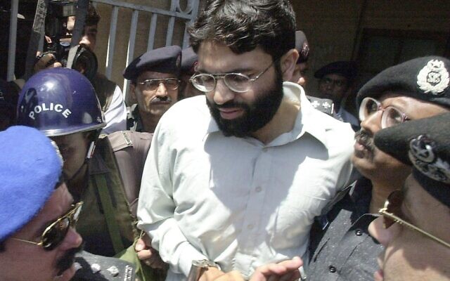 In this March 29, 2002, photo, Ahmed Omar Saeed Sheikh, the alleged mastermind behind Wall Street Journal reporter Daniel Pearl's kidnap-slaying, is escorted by police in Karachi, Pakistan. (Aamir Qureshi/AFP) In this March 29, 2002, photo, Ahmed Omar Saeed Sheikh, the alleged mastermind behind Wall Street Journal reporter Daniel Pearl's kidnap-slaying, is escorted by police in Karachi, Pakistan. (Aamir Qureshi/AFP)
