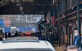 Cars transporting members of the World Health Organization (WHO) team, investigating the origins of the COVID-19 coronavirus, arrive at the closed Huanan Seafood wholesale market in Wuhan, China's central Hubei province on January 31, 2021. Hector RETAMAL/AFP)