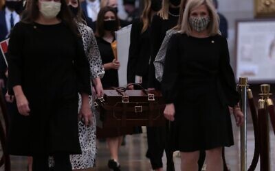 US Senate staff carry boxes containing state Electoral College votes at the U.S. Capitol, January 6, 2021. Brennan Leach, a Northwestern student whose photo went viral, is second from left, partially obscured. (Cheriss May/Getty Images/ via JTA/ SUE)