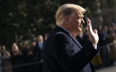 US President Donald Trump waves as he walks toward Marine One on the South Lawn of the White House, on January 12, 2021, in Washington. (Drew Angerer/Getty Images/AFP)
