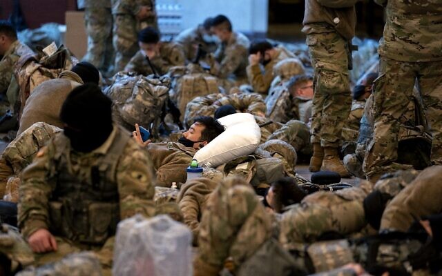 WASHINGTON, DC - JANUARY 13: Members of the National Guard sleep in the Visitor Center of the U.S. Capitol on January 13, 2021 in Washington, DC (Stefani Reynolds/Getty Images/AFP