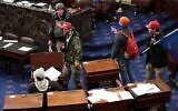 Pro-Trump protesters enter the Senate Chamber on January 6, 2021 in Washington, DC. (Win McNamee/Getty Images/AFP
