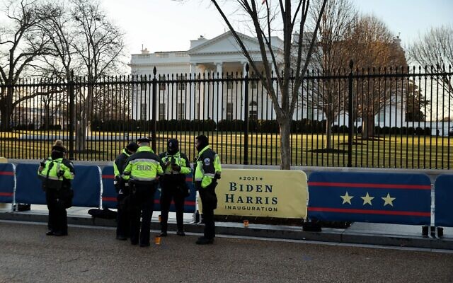 Washington Metro Police officers stand on Pennsylvania Avenue in front of the White House head of inaugural events on January 20, 2021 in Washington, DC.(Chip Somodevilla/Getty Images/AFP) Washington Metro Police officers stand on Pennsylvania Avenue in front of the White House head of inaugural events on January 20, 2021 in Washington, DC.(Chip Somodevilla/Getty Images/AFP)