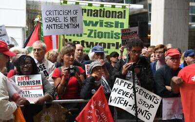 Activists outside a meeting of the Labour National Executive Committee in London, with signs protesting the IHRA definition of anti-Semitism, September 4, 2018. (Stefan Rousseau/PA Images via Getty Images/ via JTA /SUE)