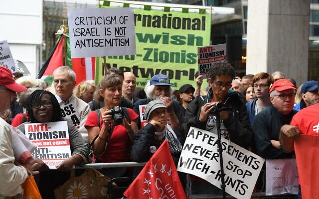 Activists outside a meeting of the Labour National Executive Committee in London, with signs protesting the IHRA definition of anti-Semitism, September 4, 2018. (Stefan Rousseau/PA Images via Getty Images/ via JTA /SUE) Activists outside a meeting of the Labour National Executive Committee in London, with signs protesting the IHRA definition of anti-Semitism, September 4, 2018. (Stefan Rousseau/PA Images via Getty Images/ via JTA /SUE)