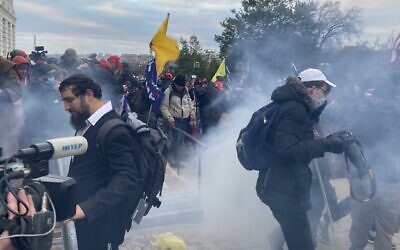 Security forces respond with tear gas after US President Donald Trump's supporters breached the US Capitol security in Washington DC on January 6, 2021. (Tayfun Coskun/Anadolu Agency via Getty Images)