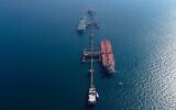 An aerial photo shows oil tankers load crude oil at Iraq's Al-Basra Offshore Terminal in Basra, Iraq, Sunday, Dec. 27, 2020. (AP Photo/Nabil al-Jurani)