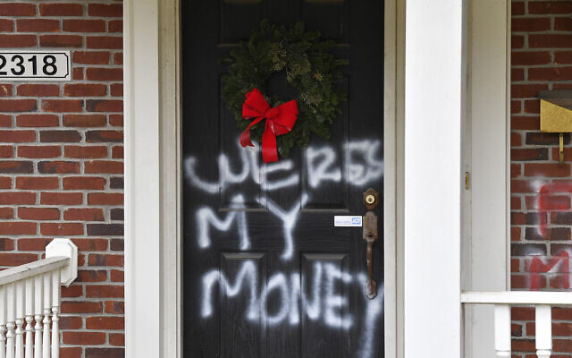 Graffiti reading, 'Where's my money' is seen on a door of the home of Senate Majority Leader Mitch McConnell in Louisville, Kentucky, Jan. 2, 2021 (AP Photo/Timothy D. Easley) Graffiti reading, 'Where's my money' is seen on a door of the home of Senate Majority Leader Mitch McConnell in Louisville, Kentucky, Jan. 2, 2021 (AP Photo/Timothy D. Easley)