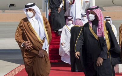 Saudi Arabia's Crown Prince Mohammed bin Salman, right, welcomes Qatar's Emir Sheikh Tamim bin Hamad al-Thani upon his arrival to attend the Gulf Cooperation Council's 41st Summit in Al-Ula, Saudi Arabia, January 5, 2021. (Saudi Royal Court via AP)