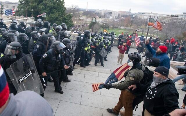 US Capitol Police push back demonstrators who were trying to enter the US Capitol on January 6, 2021, in Washington. (AP Photo/Jose Luis Magana) US Capitol Police push back demonstrators who were trying to enter the US Capitol on January 6, 2021, in Washington. (AP Photo/Jose Luis Magana)