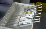 In this Jan. 7, 2021, file photo syringes containing the Pfizer-BioNTech COVID-19 vaccine sit in a tray in a vaccination room at St. Joseph Hospital in Orange, Calif. (AP/Jae C. Hong, File)
