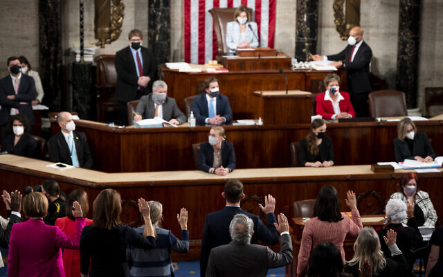 US House Speaker Nancy Pelosi administers the oath of office to members of the 117th Congress at the US Capitol in Washington, January 3, 2021. (Bill Clark/Pool Photo via AP, File) US House Speaker Nancy Pelosi administers the oath of office to members of the 117th Congress at the US Capitol in Washington, January 3, 2021. (Bill Clark/Pool Photo via AP, File)