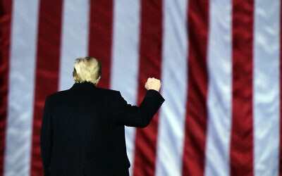 US President Donald Trump gestures at a campaign rally in support of US Senate candidates Sen. Kelly Loeffler, R-Ga., and David Perdue in Dalton, Georgia, Monday, Jan. 4, 2021 (AP Photo/Brynn Anderson)