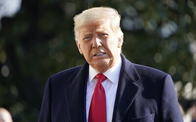 US President Donald Trump speaks to the media before boarding Marine One on the South Lawn of the White House, January 12, 2021 in Washington. (AP Photo/Gerald Herbert)