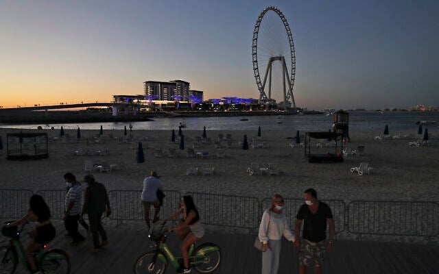 Tourists and residents enjoy the sunset at the Jumeirah Beach Residence, in Dubai, United Arab Emirates, January 12, 2021. (AP Photo/Kamran Jebreili) Tourists and residents enjoy the sunset at the Jumeirah Beach Residence, in Dubai, United Arab Emirates, January 12, 2021. (AP Photo/Kamran Jebreili)