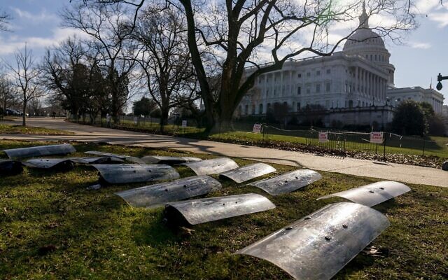 The dome of the US Capitol building is visible as riot gear is laid out on a field on Capitol Hill in Washington, January 13, 2021. (AP Photo/Andrew Harnik) The dome of the US Capitol building is visible as riot gear is laid out on a field on Capitol Hill in Washington, January 13, 2021. (AP Photo/Andrew Harnik)