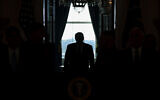 US President Donald Trump arrives to address the nation from the White House on the ballistic missile strike that Iran launched against Iraqi air bases housing US troops in Washington, January 8, 2020. (AP Photo/ Evan Vucci)