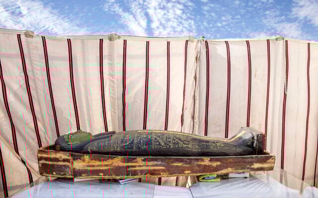 CORRECTS DAY OF WEEK TO SUNDAY -- A trove of ancient coffins and artifacts on display that Egyptian archaeologist Zahi Hawass and his team unearthed in a vast necropolis, in Saqqara, south of Cairo, Egypt, January 17, 2021. (AP Photo/Nariman El-Mofty)