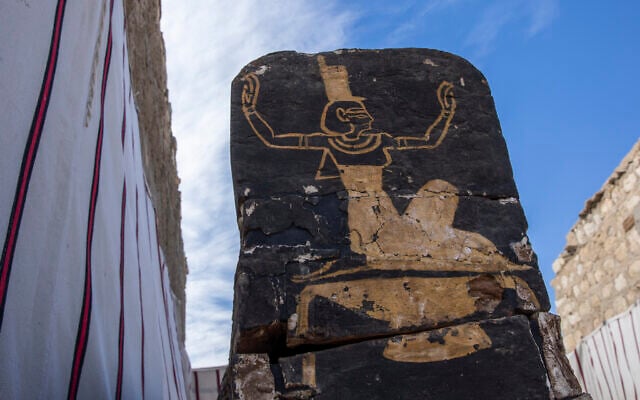 An ancient coffin is on display that Egyptian archaeologist Zahi Hawass and his team unearthed in a vast necropolis filled with burial shafts, coffins and mummies dating back to the New Kingdom 3000 BC, January 17, 2021, in Saqqara, south of Cairo, Egypt. (AP Photo/Nariman El-Mofty)