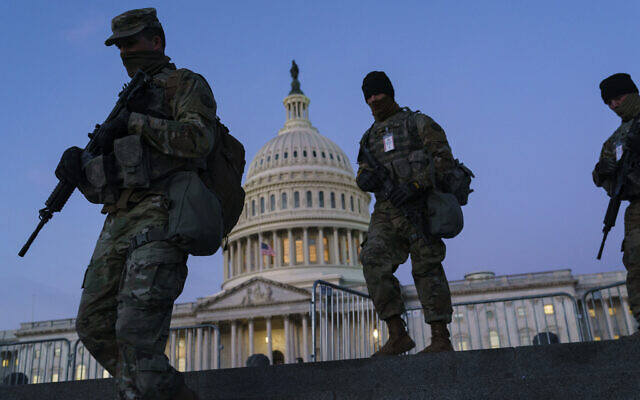 US National Guard troops reinforce the security zone before US President-elect Joe Biden is sworn in, on Capitol Hill in Washington, January 19, 2021. (J. Scott Applewhite/AP) US National Guard troops reinforce the security zone before US President-elect Joe Biden is sworn in, on Capitol Hill in Washington, January 19, 2021. (J. Scott Applewhite/AP)