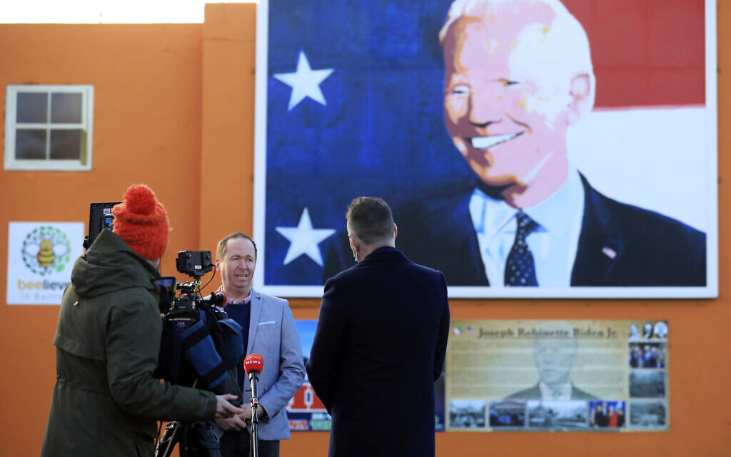 Joe Biden's cousin Joe Blewitt speaks to the media underneath his mural painted on a wall in Ballina, Ireland, January 20, 2021. (AP Photo/Peter Morrison) Joe Biden's cousin Joe Blewitt speaks to the media underneath his mural painted on a wall in Ballina, Ireland, January 20, 2021. (AP Photo/Peter Morrison)