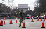A National Guard stands at a road block near the Supreme Court ahead of President-elect Joe Biden's inauguration ceremony, January 20, 2021, in Washington. (AP Photo/Gerald Herbert)