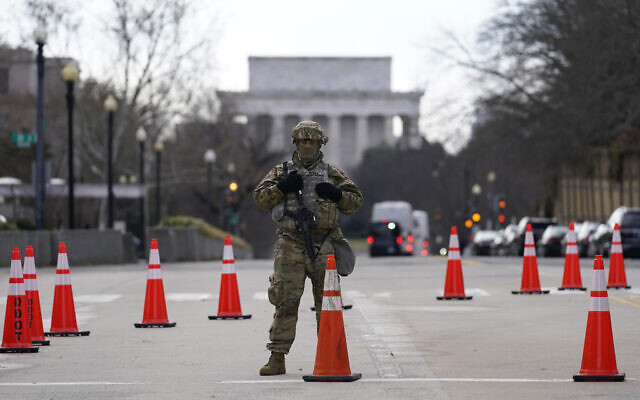 A National Guard stands at a road block near the Supreme Court ahead of President-elect Joe Biden's inauguration ceremony, January 20, 2021, in Washington. (AP Photo/Gerald Herbert) A National Guard stands at a road block near the Supreme Court ahead of President-elect Joe Biden's inauguration ceremony, January 20, 2021, in Washington. (AP Photo/Gerald Herbert)