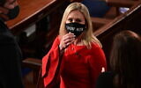 In this Sunday, January 3, 2021, file photo, Rep. Marjorie Taylor Greene, R-Ga., wears a 'Trump Won' face mask as she arrives on the floor of the House to take her oath of office on opening day of the 117th Congress at the US Capitol in Washington. (Erin Scott/Pool Photo via AP)