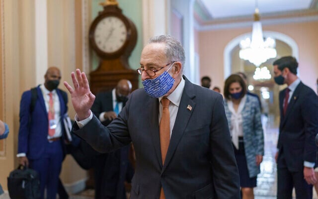 On the first full day of Democratic control, Senate Majority Leader Chuck Schumer, D-NY, walks to the chamber after meeting with new senators from his caucus, at the Capitol in Washington, Jan. 21, 2021. (AP/J. Scott Applewhite)