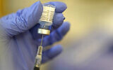 Illustrative: A pharmacist prepares a syringe of the Pfizer-BioNTech COVID-19 vaccine Friday, Jan. 8, 2021, in Seattle. (AP/Ted S. Warren)