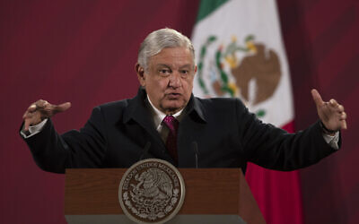 Mexican President Andres Manuel Lopez Obrador gives his daily, morning news conference at the presidential palace, Palacio Nacional, in Mexico City, December 18, 2020. (AP Photo/Marco Ugarte, File)
