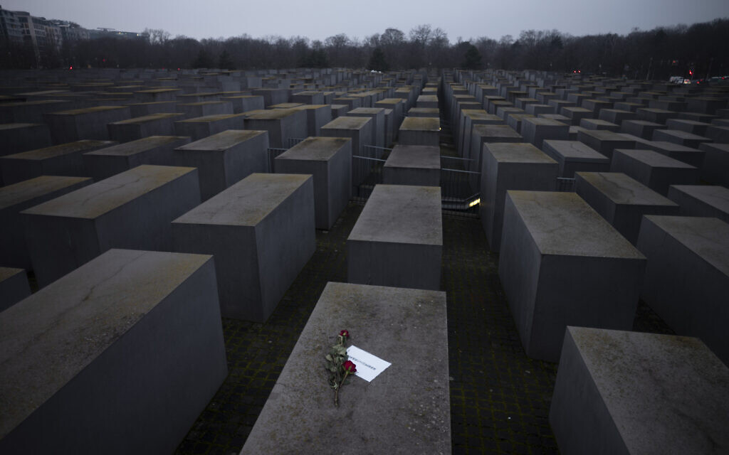 File: Roses with a note saying "#weremember" are placed on the Holocaust Memorial on International Holocaust Remembrance Day, in Berlin, Germany, January 27, 2021. (AP Photo/ Markus Schreiber) File: Roses with a note saying "#weremember" are placed on the Holocaust Memorial on International Holocaust Remembrance Day, in Berlin, Germany, January 27, 2021. (AP Photo/ Markus Schreiber)