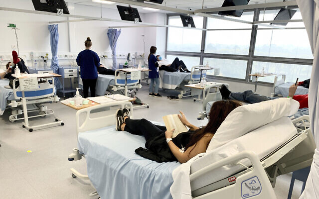 In this Tuesday, May 26, 2020 file photo released by Nucleus Network/ABC, clinical trial participants are monitored during Novavax COVID-19 vaccine testing in Melbourne, Australia (Patrick Rocca/Nucleus Network/ABC via AP) In this Tuesday, May 26, 2020 file photo released by Nucleus Network/ABC, clinical trial participants are monitored during Novavax COVID-19 vaccine testing in Melbourne, Australia (Patrick Rocca/Nucleus Network/ABC via AP)