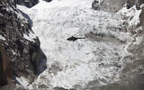 Illustrative -- A Pakistan Army helicopter flies over the site of an avalanche over Gayari camp, April 18, 2012 (AP Photo/B.K. Bangash)