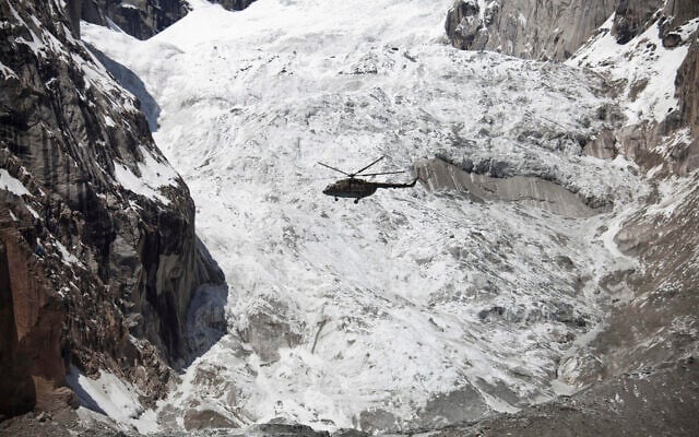Illustrative -- A Pakistan Army helicopter flies over the site of an avalanche over Gayari camp, April 18, 2012 (AP Photo/B.K. Bangash) Illustrative -- A Pakistan Army helicopter flies over the site of an avalanche over Gayari camp, April 18, 2012 (AP Photo/B.K. Bangash)