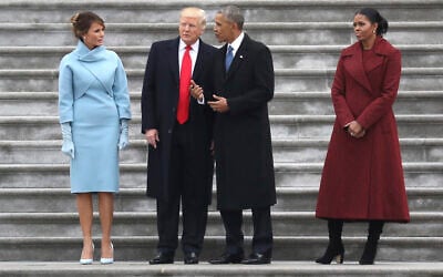 US President Donald Trump and former president Barack Obama stand on the steps of the Capitol in Washington, Jan. 20, 2017, with first lady Melania Trump and Michelle Obama, prior to the Obama's departure to Andrews Air Force Base, Md., following the presidential inauguration. (Rob Carr/Pool Photo via AP)