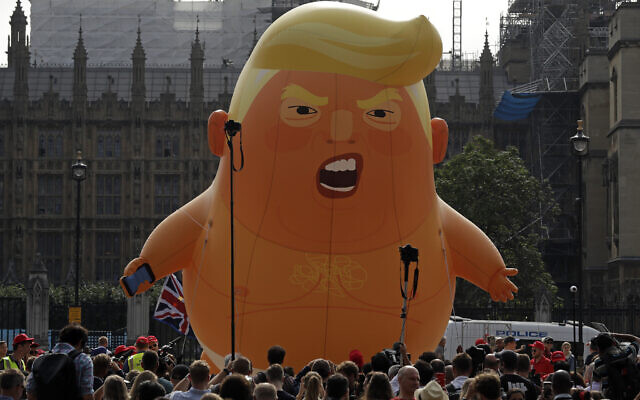 A six-meter high cartoon baby blimp of US President Donald Trump is flown as a protest against his visit, in Parliament Square in London, England, July 13, 2018. (AP Photo/Matt Dunham) A six-meter high cartoon baby blimp of US President Donald Trump is flown as a protest against his visit, in Parliament Square in London, England, July 13, 2018. (AP Photo/Matt Dunham)