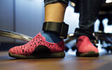 Illustrative: In this, July 23, 2018, file photo, Immigrant seeking asylum Ildra Medreano wears an ankle monitor at a Catholic Charities facility not long after she was reunited with her son in San Antonio. (AP/Eric Gay)