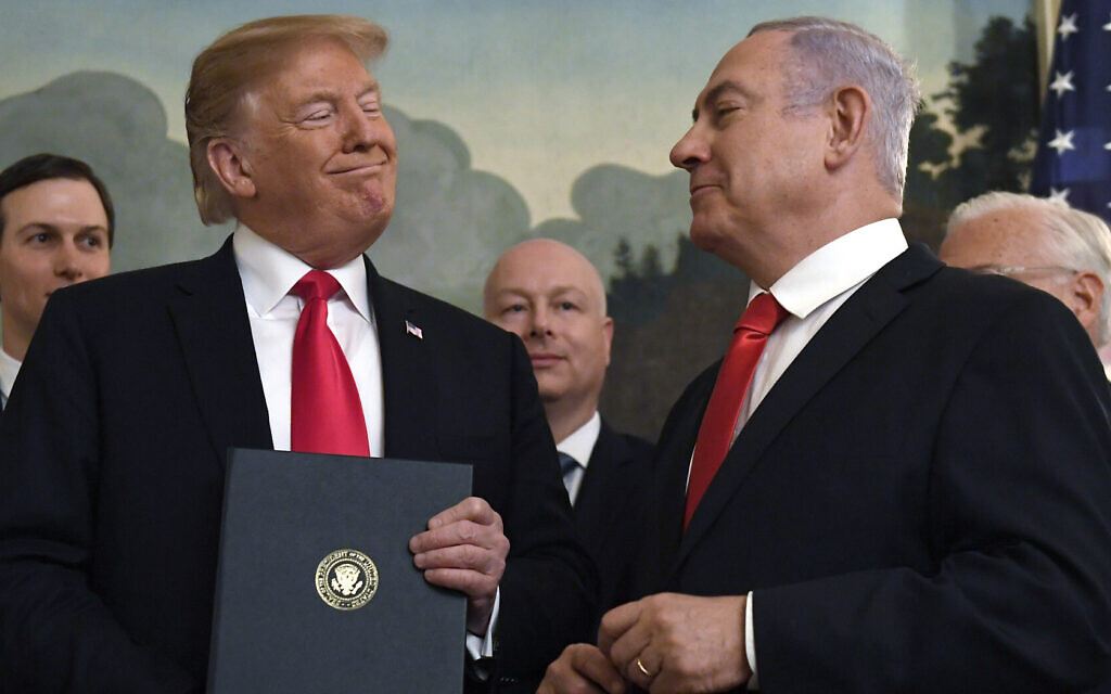 Then-US president Donald Trump (left) smiles at Prime Minister Benjamin Netanyahu after signing a proclamation recognizing the Golan Heights as part of Israel, in the Diplomatic Reception Room at the White House in Washington, on March 25, 2019. (AP Photo/ Susan Walsh) Then-US president Donald Trump (left) smiles at Prime Minister Benjamin Netanyahu after signing a proclamation recognizing the Golan Heights as part of Israel, in the Diplomatic Reception Room at the White House in Washington, on March 25, 2019. (AP Photo/ Susan Walsh)