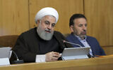 Iranian President Hassan Rouhani speaks during a cabinet meeting, as his chief of staff Mahmoud Vaezi sits at right, in Tehran, Iran, July 10, 2019. (Iranian Presidency Office via AP)