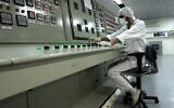 In this Feb. 3, 2007 file photo, a technician works at the Uranium Conversion Facility just outside the city of Isfahan, Iran. (AP Photo/Vahid Salemi, File)