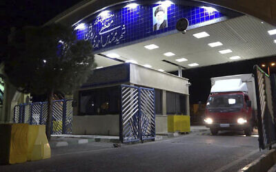 A truck containing cylinder of uranium hexafluoride gas leaves Ahmadi Roshan uranium enrichment facility in Natanz to Fordo nuclear facility for the purpose of injecting the gas into Fordo centrifuges, November 6, 2019. (Atomic Energy Organization of Iran via AP)