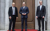 German Foreign Minister Heiko Maas, center, welcomes the Foreign Minister of Great Britain, Dominic Raab, right, and the Foreign Minister of France, Jean-Yves Le Drian, left, for a meeting in Berlin, Germany, June 19, 2020. (Bernd von Jutrczenka/DPA via AP, Pool)