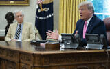 Senate Majority Leader Mitch McConnell of Ky., listens as US President Donald Trump speaks during a meeting in the Oval Office of the White House, Monday, July 20, 2020, in Washington. (AP Photo/Evan Vucci)