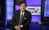 Tucker Carlson, host of 'Tucker Carlson Tonight,' poses for photos in a Fox News Channel studio, March 2, 2017 in New York. (AP Photo/Richard Drew)