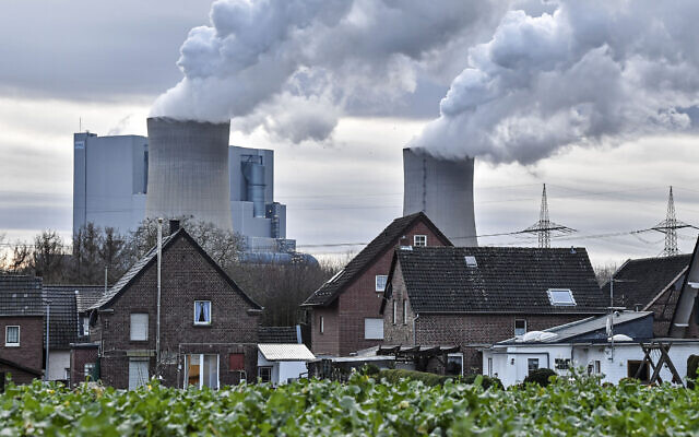In this January 13, 2020, photo RWE lignite-fired power station releases steam in Bergheim, Germany (AP Photo/Martin Meissner) In this January 13, 2020, photo RWE lignite-fired power station releases steam in Bergheim, Germany (AP Photo/Martin Meissner)